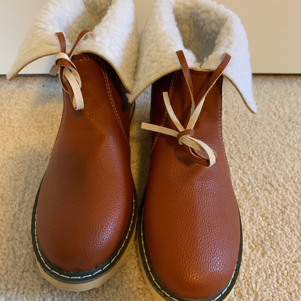 Boots; never worn. Style up or fold down.